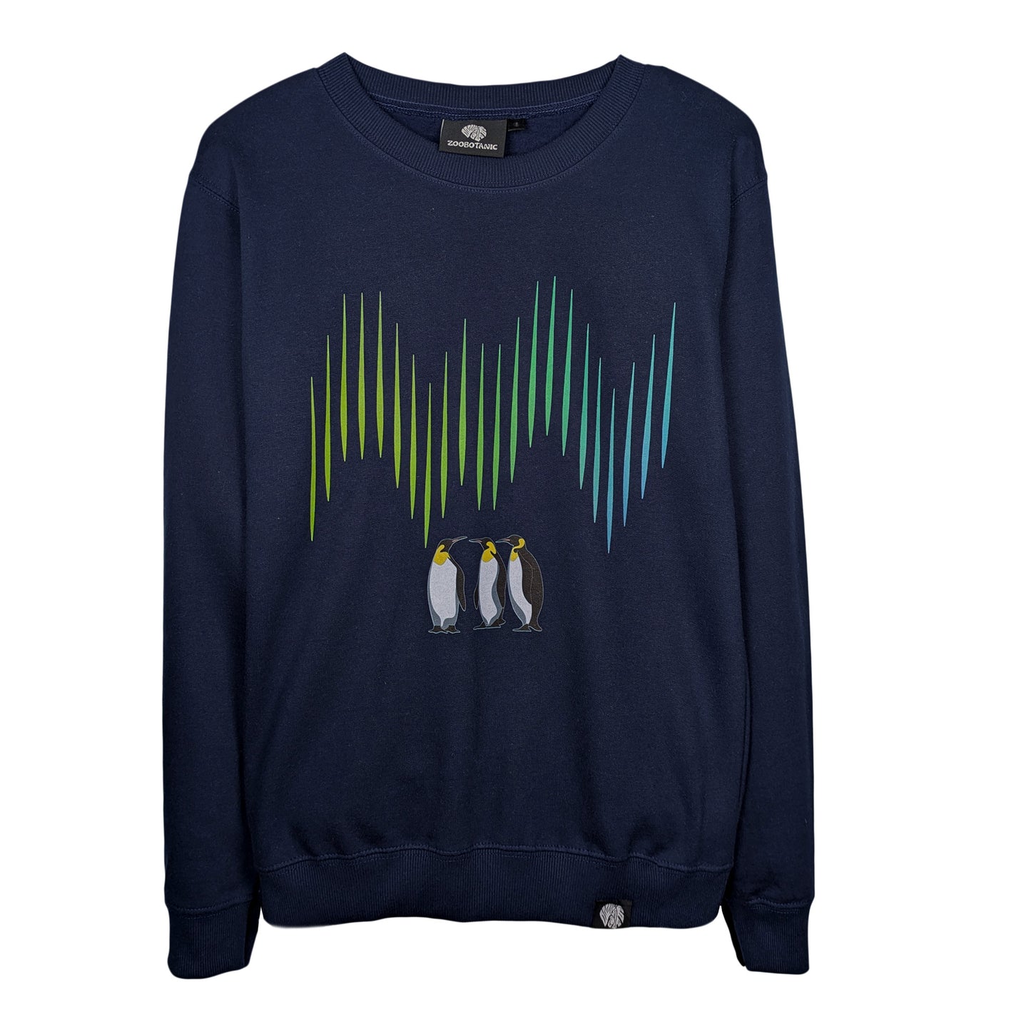 Front view of a navy Zoobotanic Unisex Emperor Penguin Z02 heavyweight fleece sweatshirt. Where designs call nature to mind, it features a detailed illustration of three emperor penguins standing beneath vibrant green and blue vertical aurora light bands.